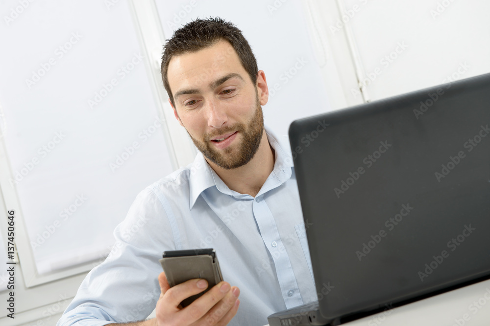 Portrait of a young businessman in his office Portrait of a young businessman in his office