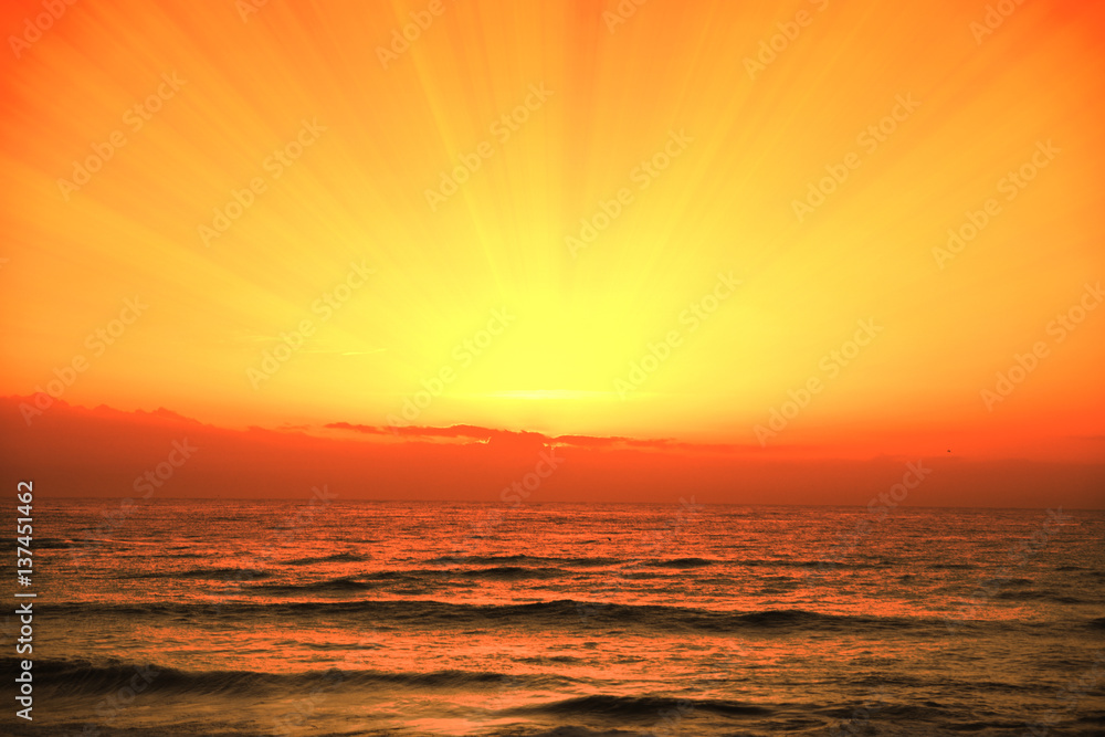 Orange cloudy sky, sunset time on the beach. Background and Empty copy space for editor's text. Orange cloudy sky, sunset time on the beach. Background and Empty copy space for editor's text.