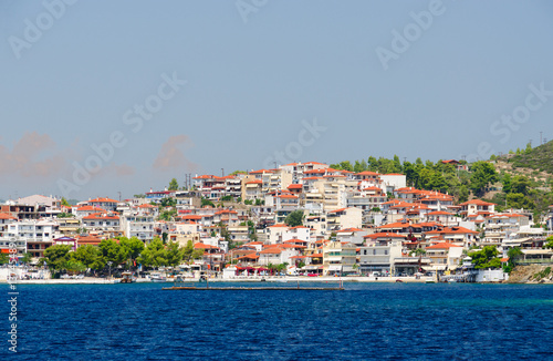 View from sea on promenade, Neos Marmaras, Sithonia Peninsula, Greece © olga355