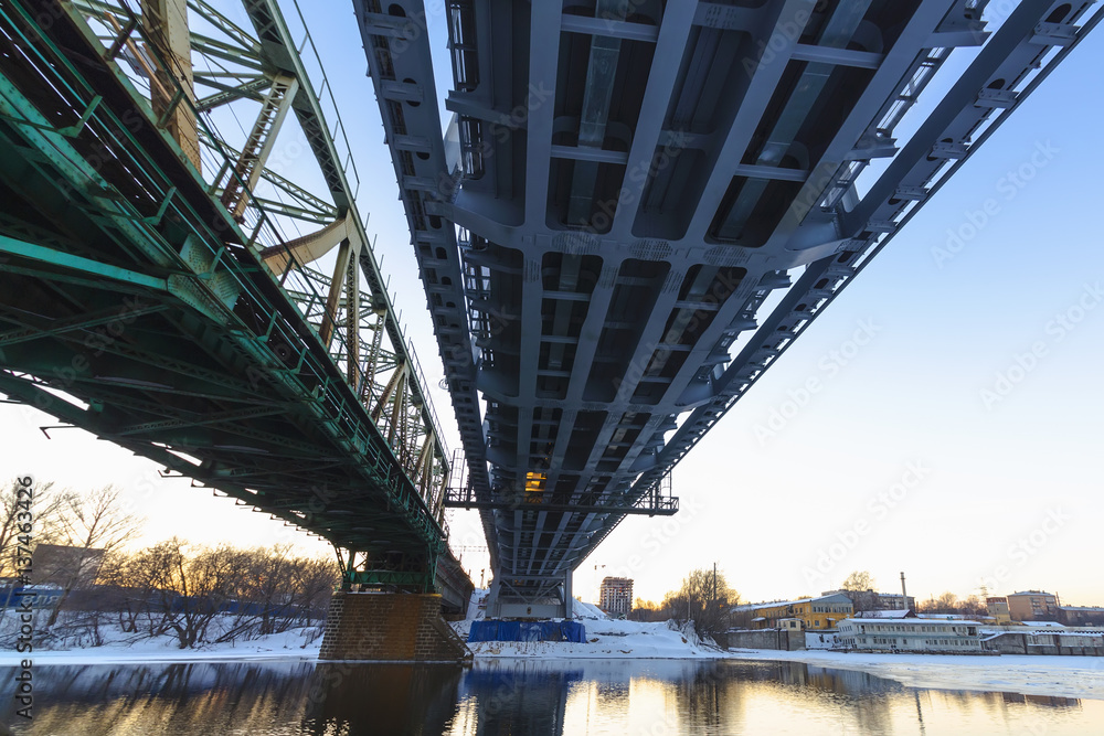 Steel railroad bridge at sundown
