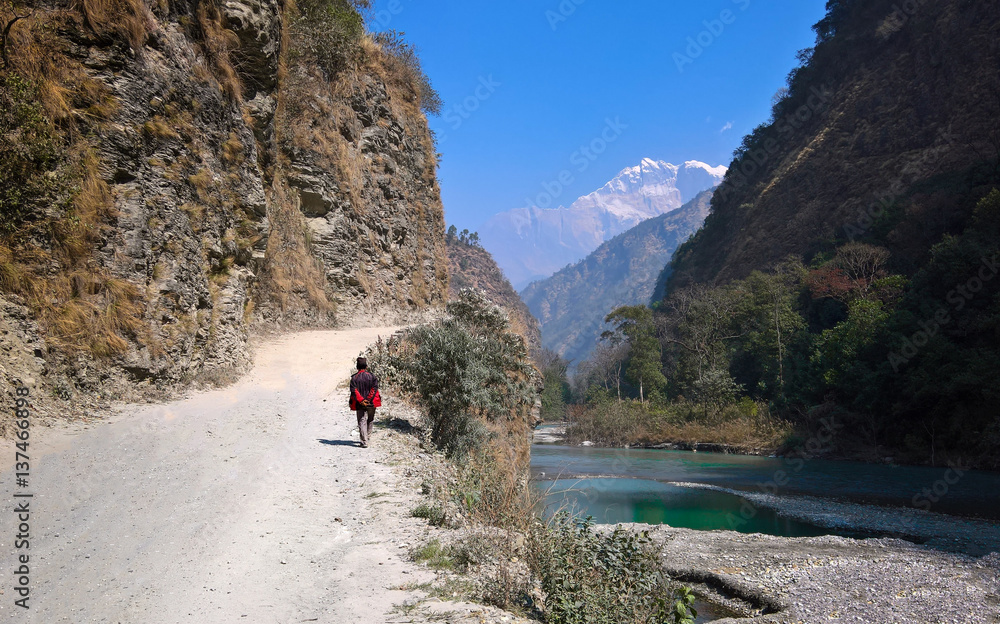 Man Walking on Dusty Dirt Road Man Walking on Dusty Dirt Road