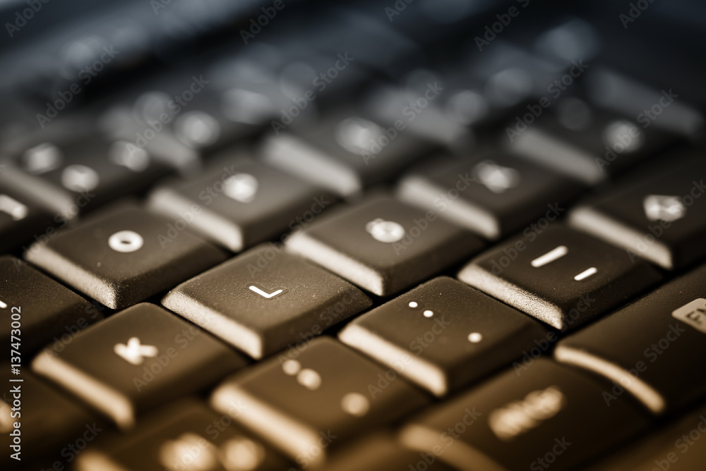 Computer keyboard with black buttons, close up as background for business office and creative writing