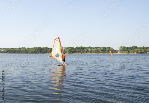 Winsurfing on calm lake