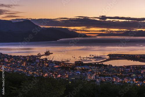 Orange and purple pre-dawn light over Ushuaia; Ushuaia, Antarctica