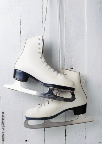 Women's figure skates hanging; Montreal, Quebec, Canada photo