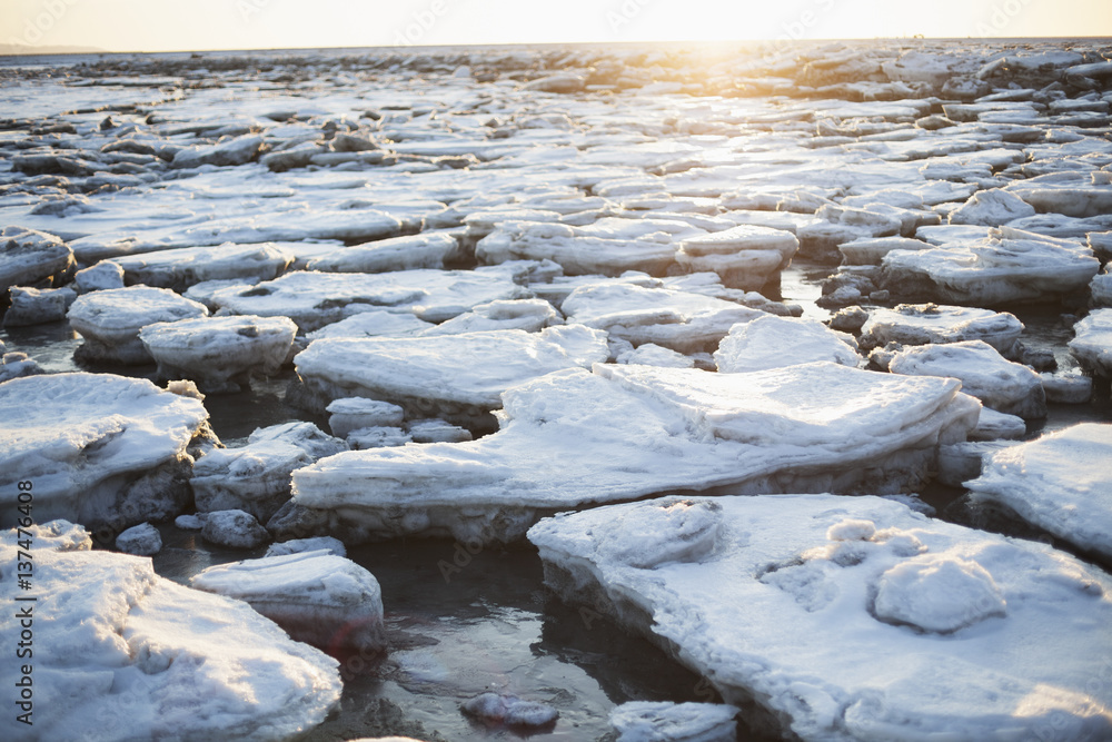 Ice chunks on beach at sunset, Homer, Alaska, USA Ice chunks on beach at sunset, Homer, Alaska, USA