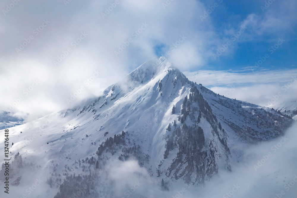 Snow covered landscape with clouds and trees Snow covered landscape with clouds and trees