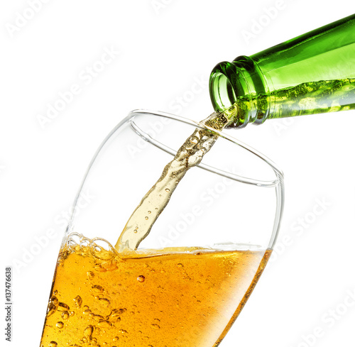 bottle pouring beer in a glass on white background