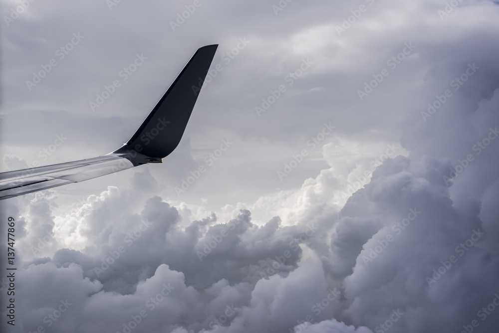 A commercial jet flies above the clouds over Illinois; United States of America A commercial jet flies above the clouds over Illinois; United States of America