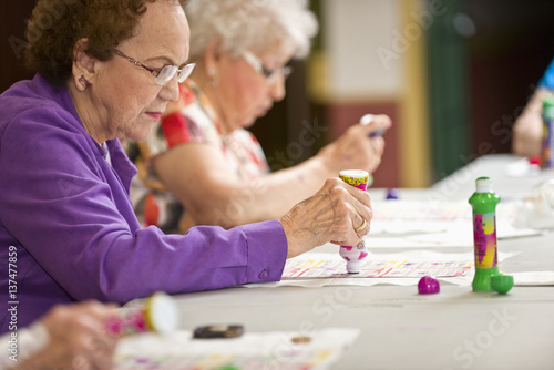 Senior citizens playing bingo; Devon, Alberta, Canada photo