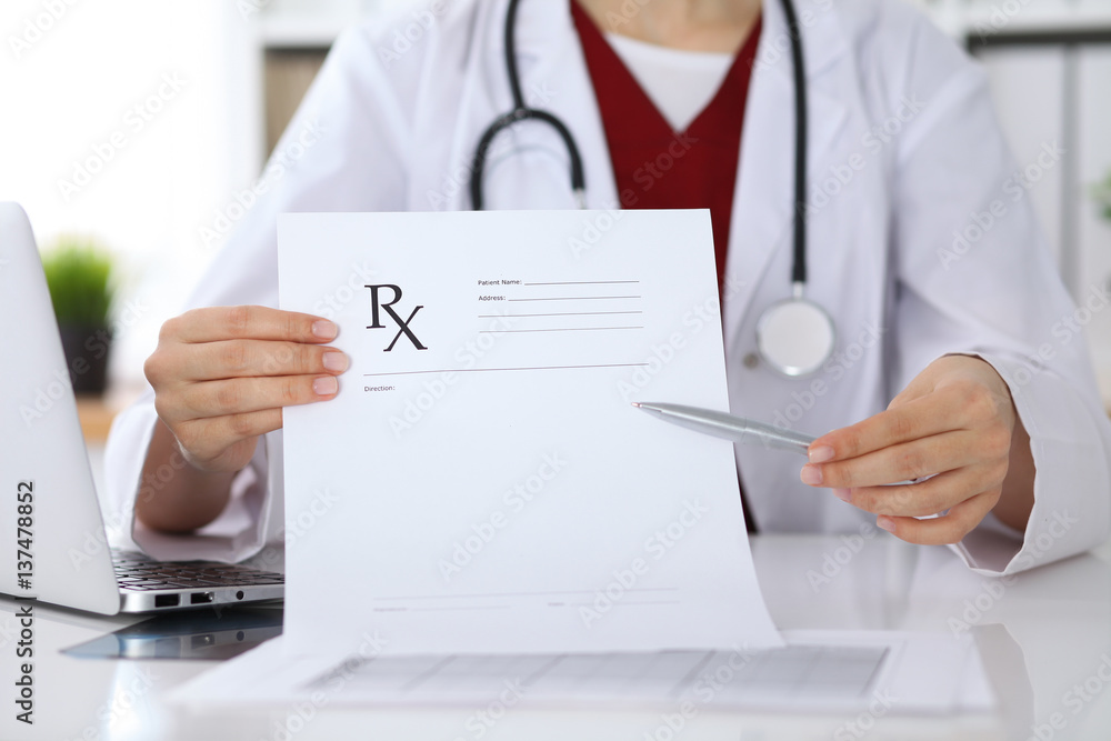 Female medicine doctor hand hold clipboard pad and give prescription to patient closeup. Panacea and life save, prescribe treatment, legal drug store, contraception concept Female medicine doctor hand hold clipboard pad and give prescription to patient closeup. Panacea and life save, prescribe treatment, legal drug store, contraception concept