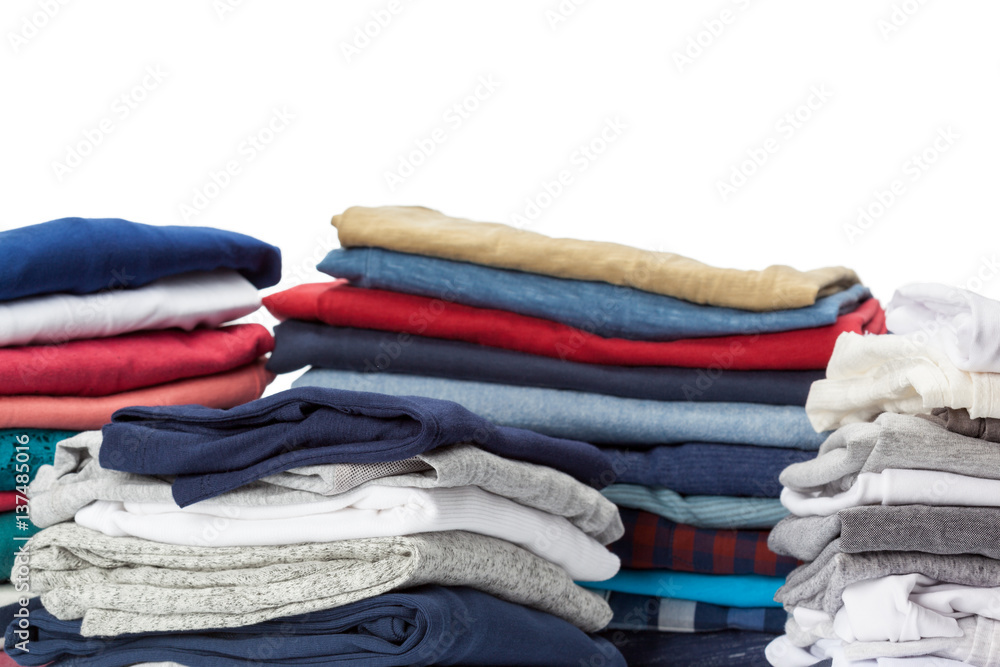 Stack of clothes on white background, closeup Stack of clothes on white background, closeup
