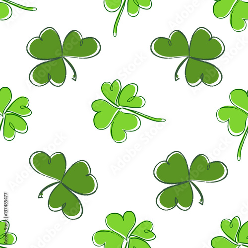 Clover seamless pattern. Clover pattern with three and four leaf. St. Patrick's Day hand-drawn chaotic clover endless repeat backdrop, texture, wallpaper. Luck symbol backdrop.