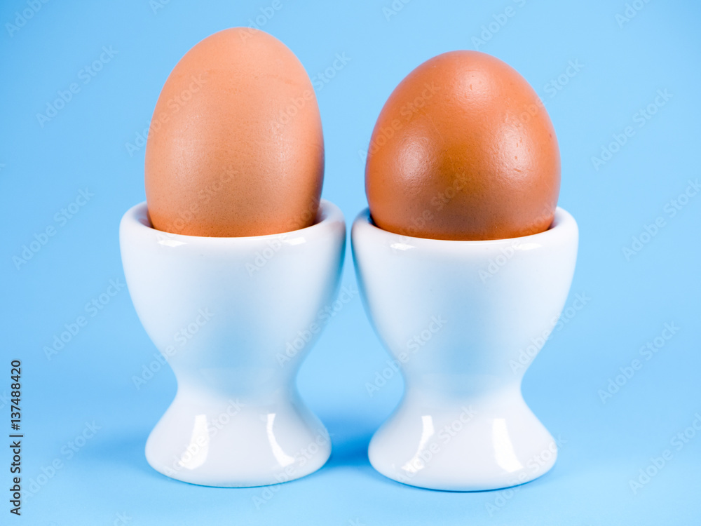 two eggs in egg cups two eggs in egg cups