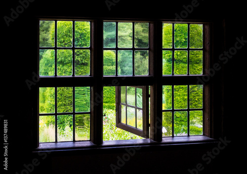 The wall and window of an old farmhouse inside