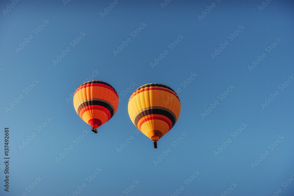 group of colorful hot air balloons against a blue sky group of colorful hot air balloons against a blue sky