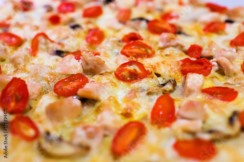 Homemade pizza with tomatoes, cheese and champignons