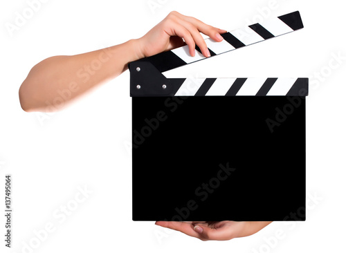 Hands holding a clapper board