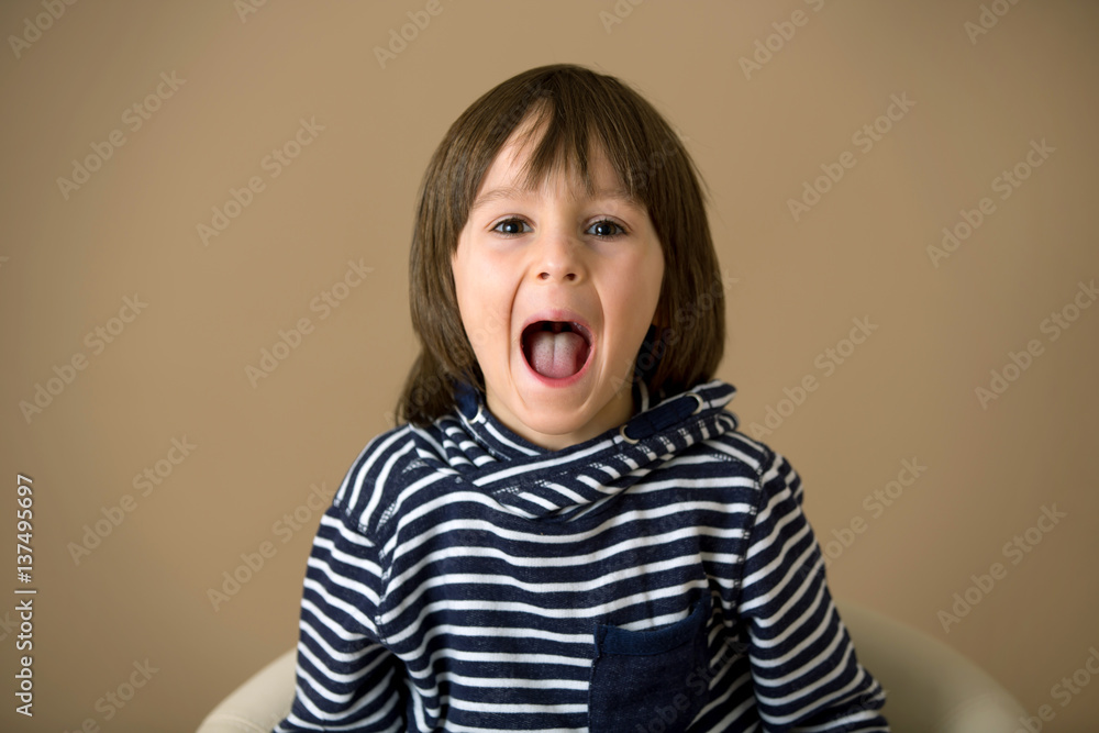 Sweet preschool boy, making faces with different emotion Sweet preschool boy, making faces with different emotion