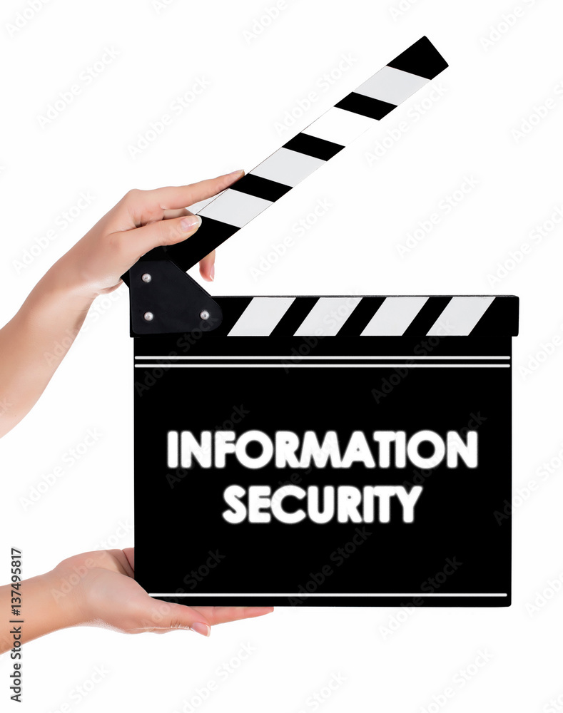 Hands holding a clapper board with INFORMATION SECURITY text