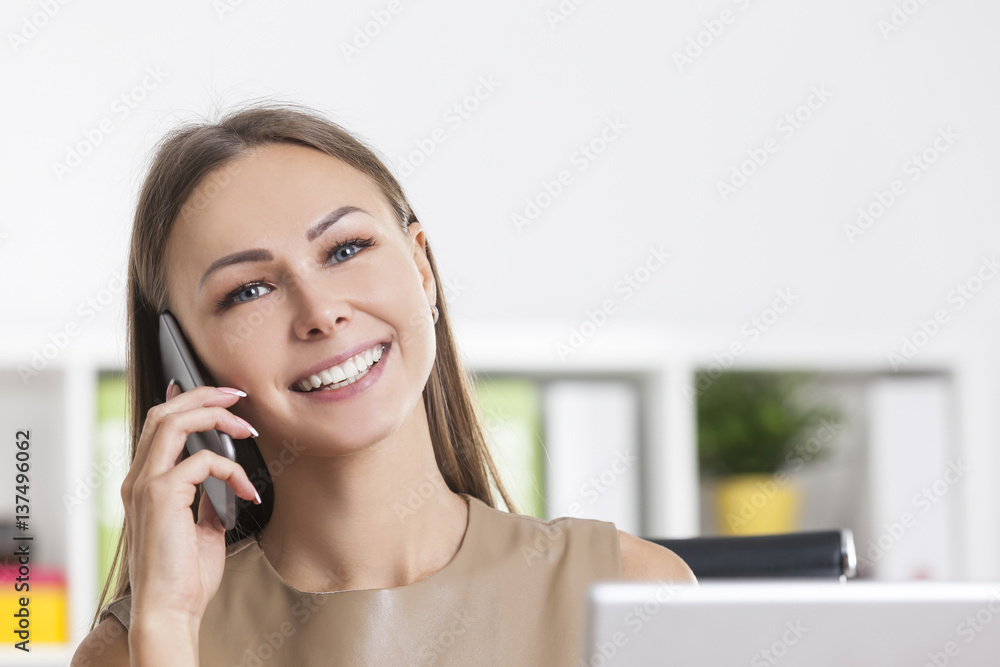 Portrait of cheerful girl in beige on phone Portrait of cheerful girl in beige on phone