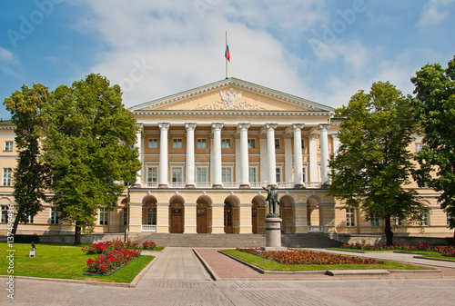 Facade of the Smolny Institute and a Lenin statue Saint-Petersburg, Russia photo