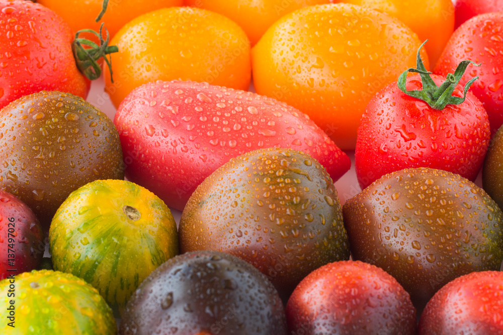 Red tomatoes with water drops closeup. top view Red tomatoes with water drops closeup. top view