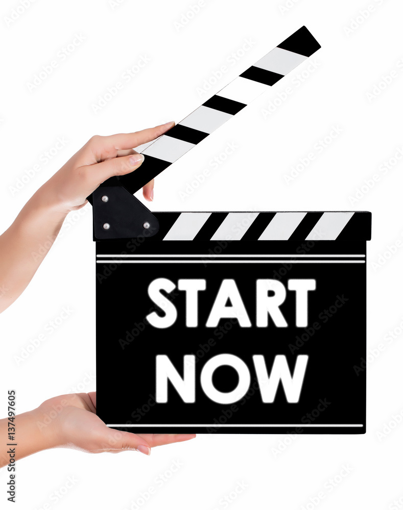 Hands holding a clapper board with START NOW text