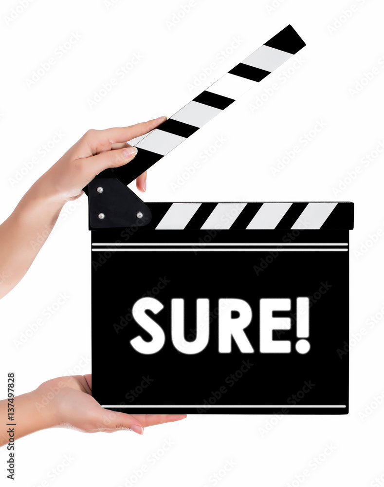 Hands holding a clapper board with SURE text