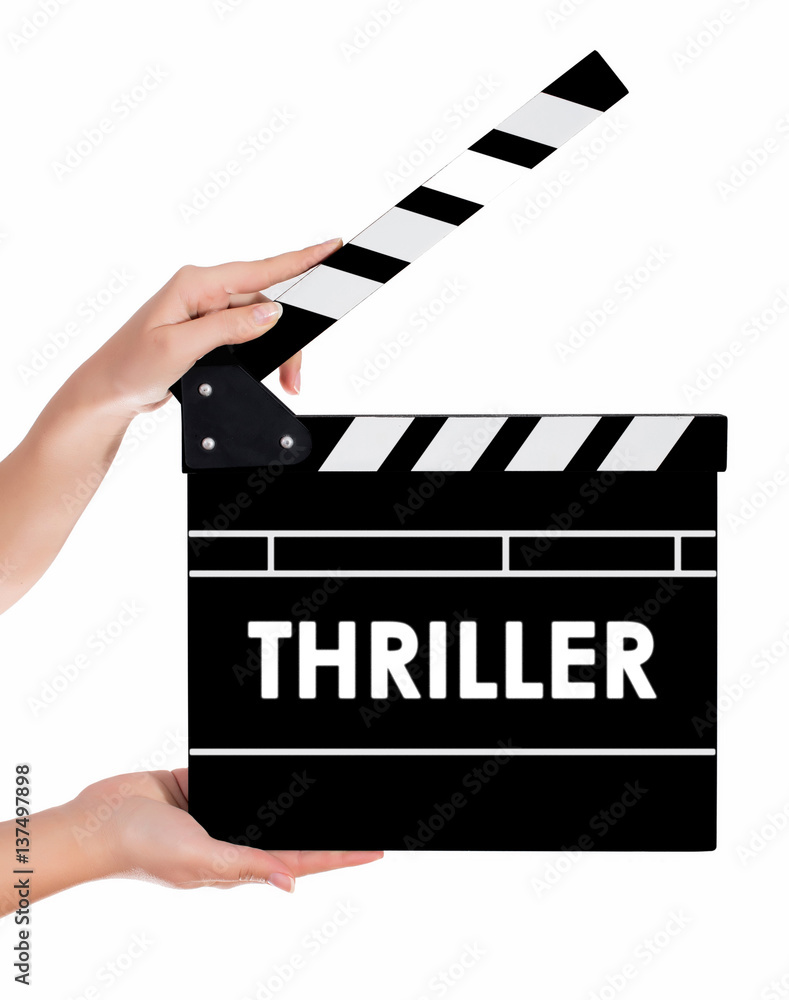 Hands holding a clapper board with THRILLER text