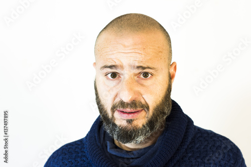 Handsome, bald man with beard on white background