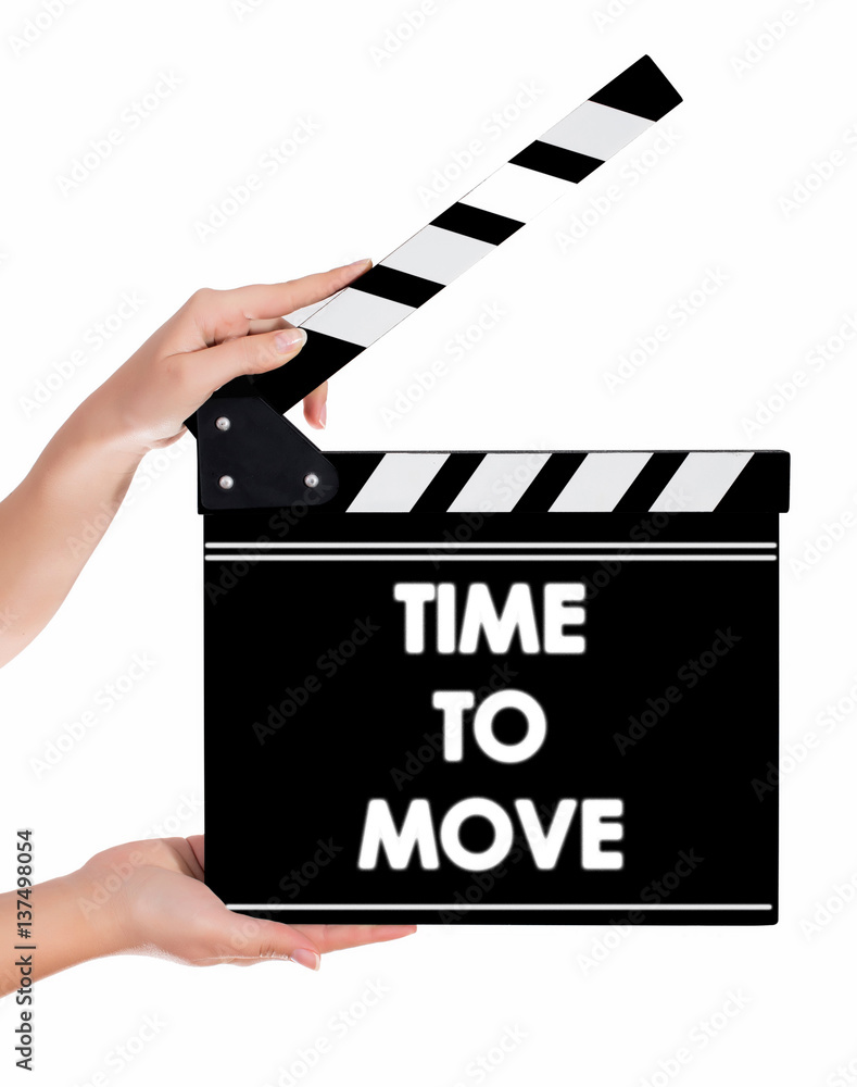 Hands holding a clapper board with TIME TO MOVE text
