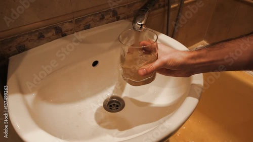 Faucet water runs in sink, starts out dirty rusty golden brown then turns clean