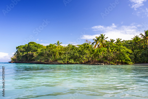 the view from the crystal clear sea to the tropical uninhabited island