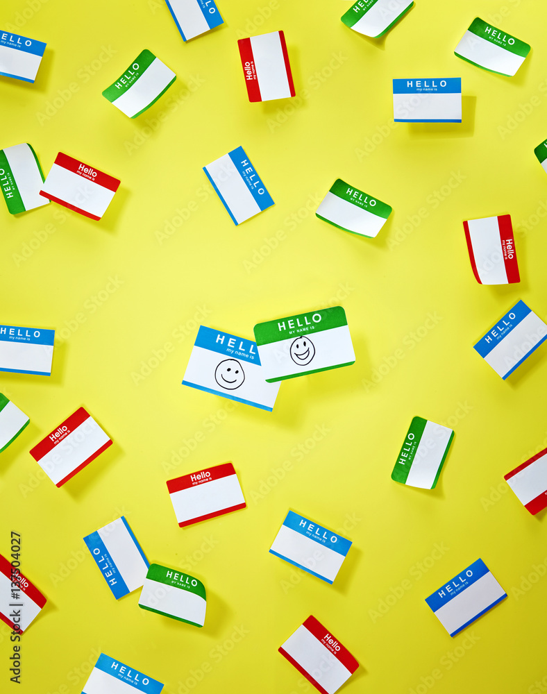 Red green and blue 'hello' stickers on yellow background Red green and blue 'hello' stickers on yellow background