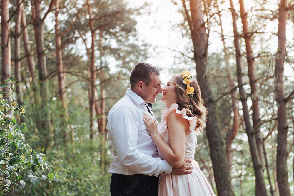 Happy couple in a pine forest Beauty world Happy couple in a pine forest Beauty world