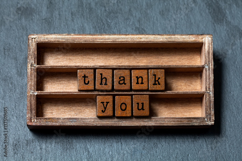 Wallpaper Mural Thank you concept. Vintage box, wooden cubes phrase with old style letters. Gray stone textured background. Close-up, up view, soft focus. Torontodigital.ca