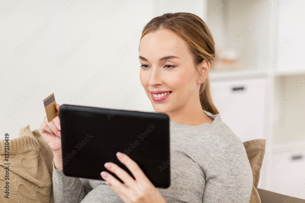 happy woman with tablet pc and credit card happy woman with tablet pc and credit card
