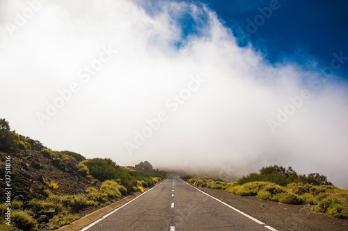 Road over clouds on Teide mountains in Tenerife, Canary Islands