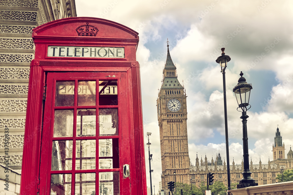London - Big Ben tower and a red phone booth. Vintage film effect. Instagram filter
