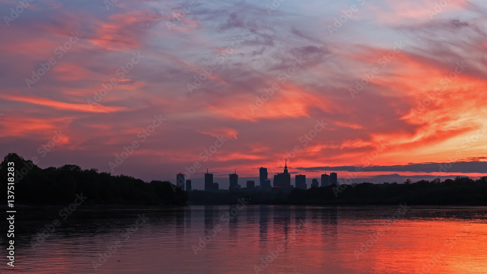Silhouette of the city of Warsaw against the sky at sunset