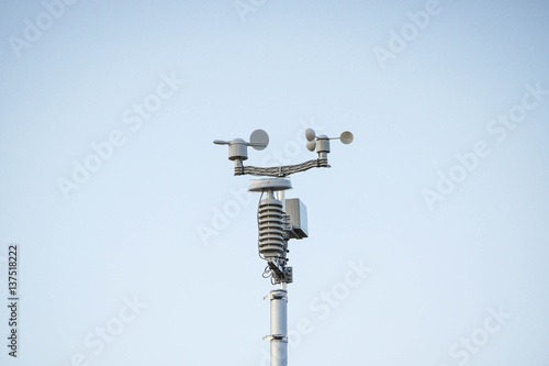 Weather station on blue sky background