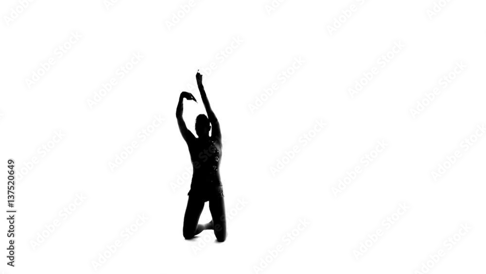 Gymnast holding a mace and professional bent. White background. Silhouette. Slow motion Gymnast holding a mace and professional bent. White background. Silhouette. Slow motion