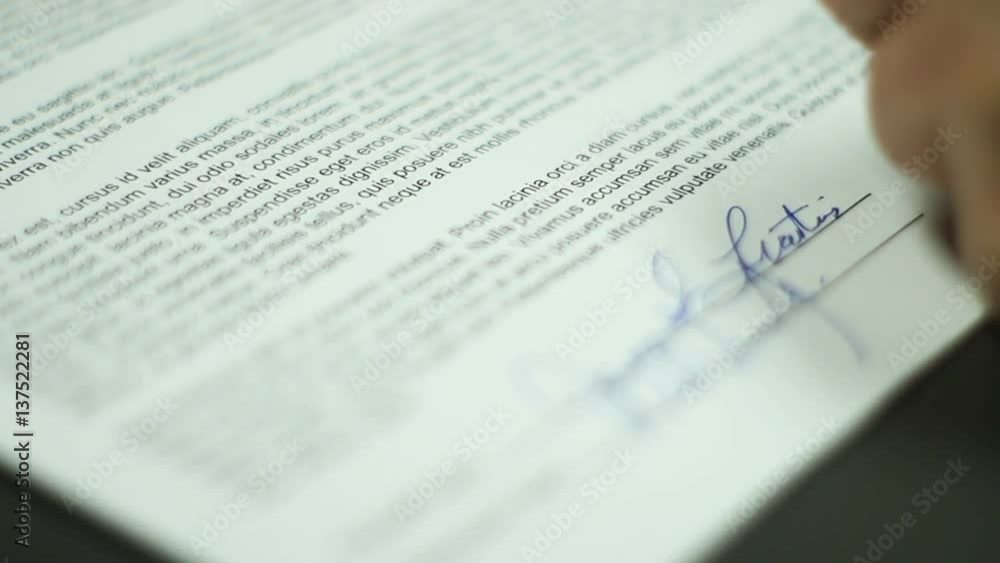 Man Signs Contract Close Up Shallow DOF Man Signs Contract Close Up Shallow DOF