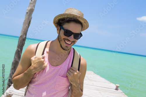 Young man traveling in Holbox island, Mexico.