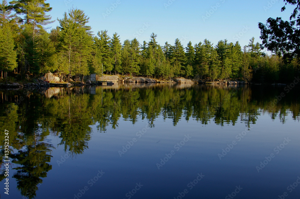 Small dock on a calm lake in Canada
