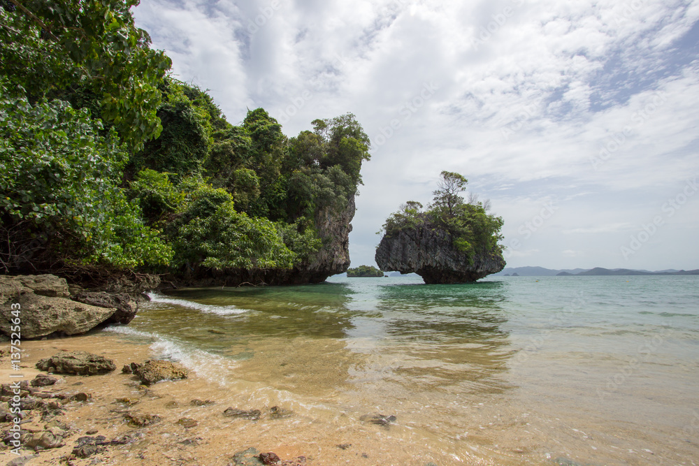 Limestone cliffs,white sand and pretty clear water at Hong Islands,Krabi Province,Southern Thailand