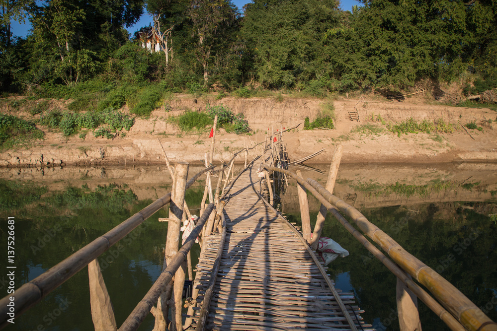 Bamboo bridge on Mekong River in Luang Phrabang, Laos Bamboo bridge on Mekong River in Luang Phrabang, Laos