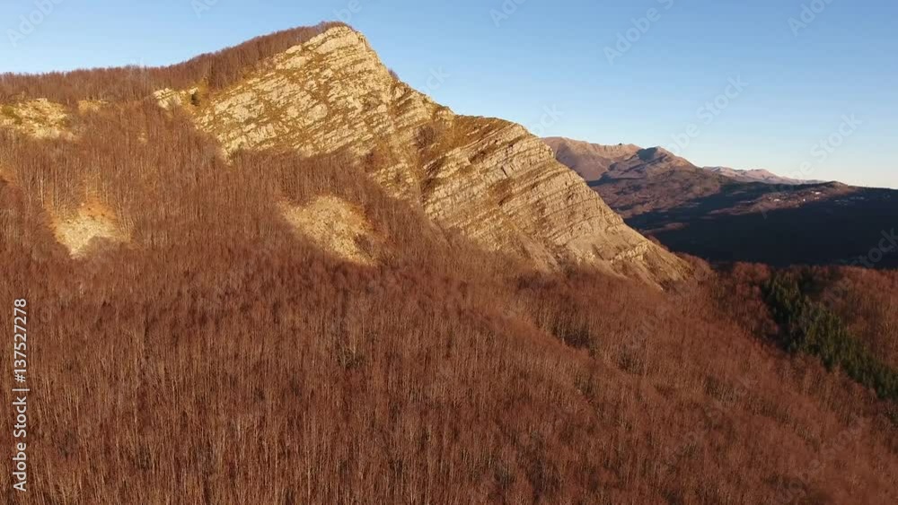 Aerial shot, autumn landscape in the high mountains with coniferous wood, sun going down, filmed with drone Aerial shot, autumn landscape in the high mountains with coniferous wood, sun going down, filmed with drone