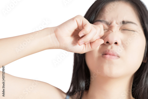 Eyes pain and eyes strain in a woman isolated on white background. Clipping path on white background.